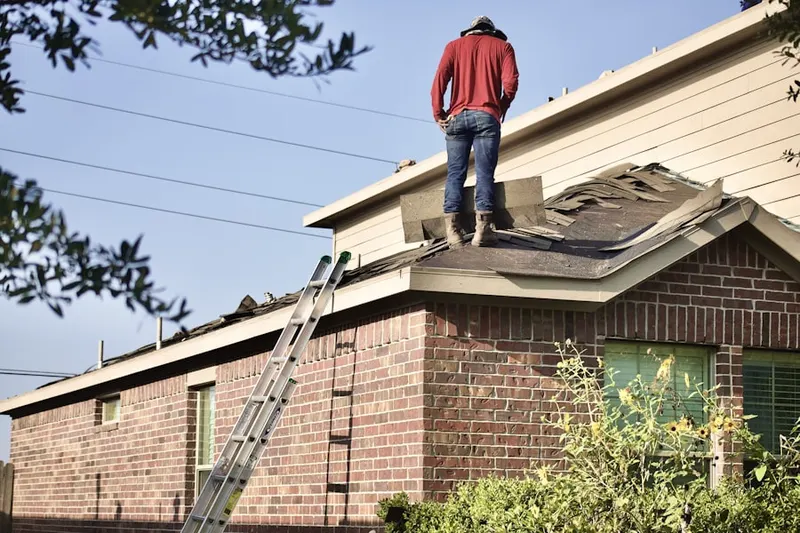 Professional roofer working on a residential roof in Coppell